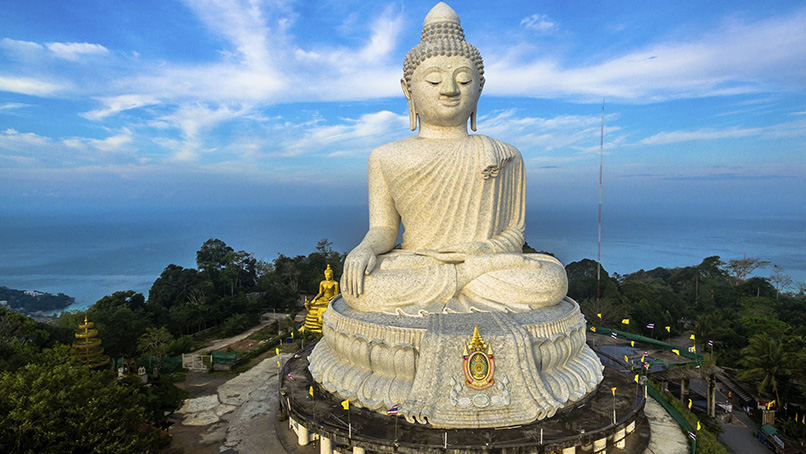 Big Buddha statue above the coast